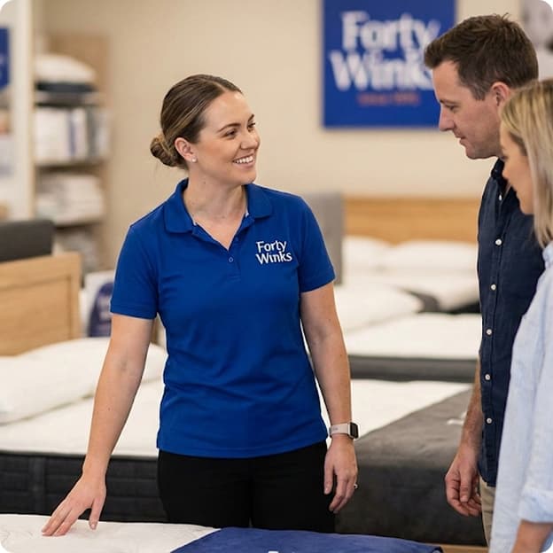 Sleep advisor talking with customers in-store